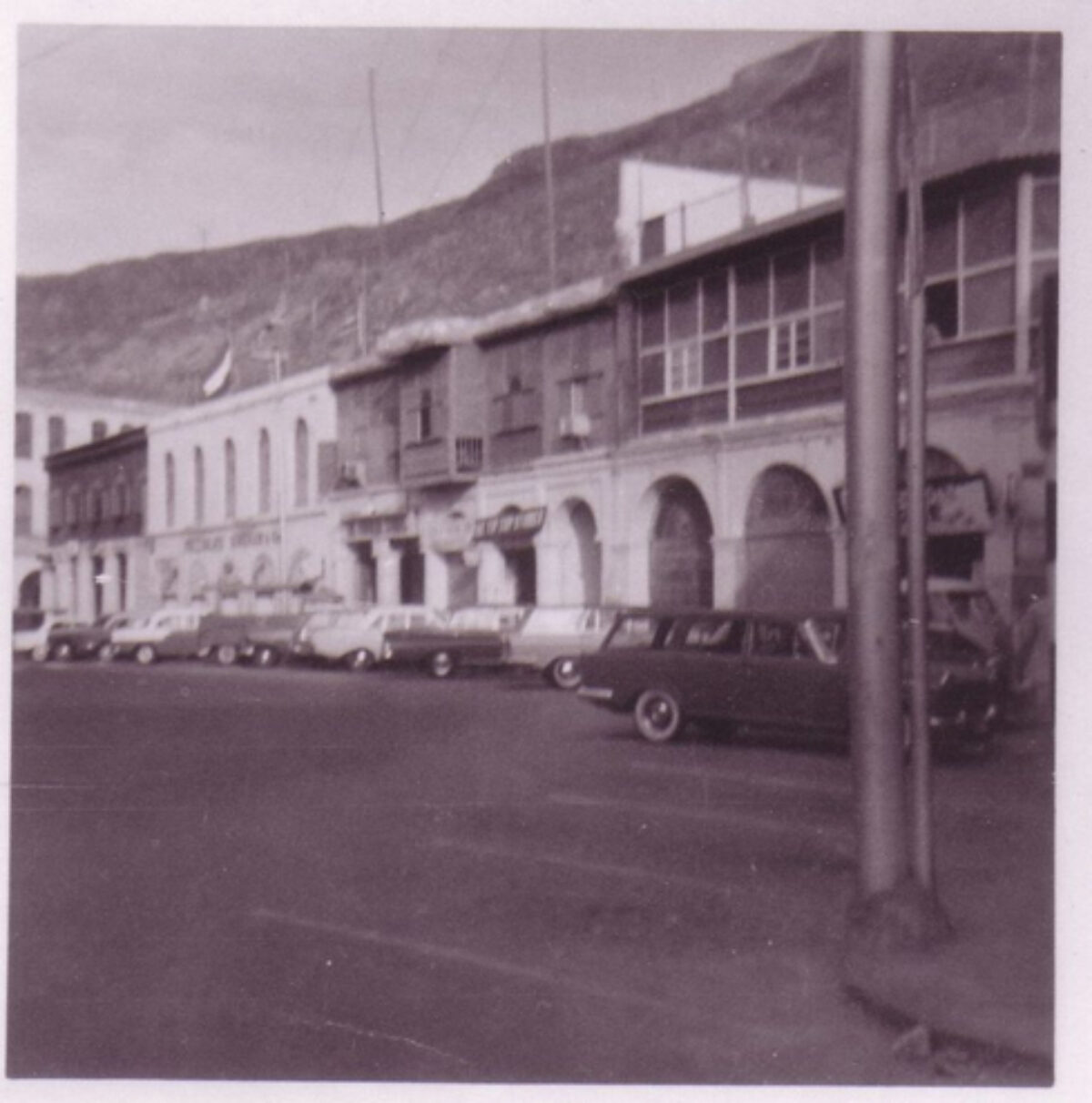 Cars parked outside a building in the city in Aden Cars parked outside a building in the city in Aden