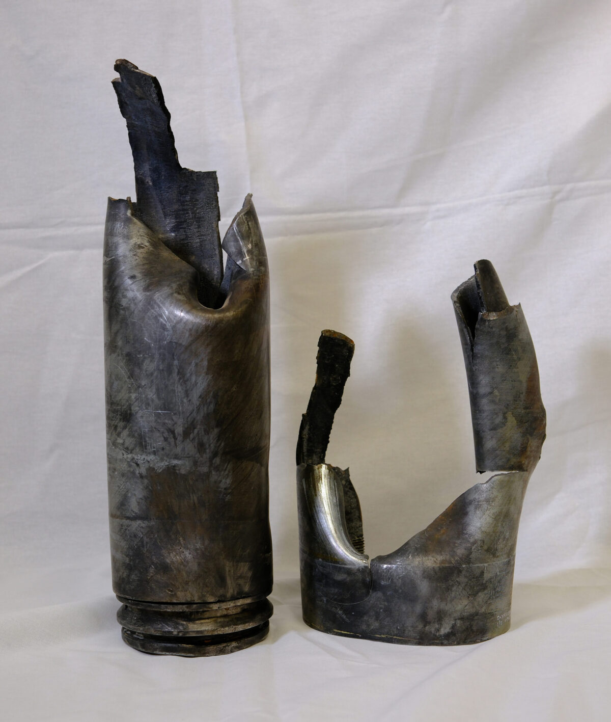 2 parts of an enemy mortar shell.