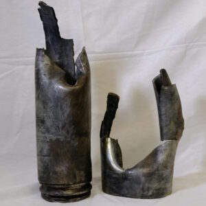 2 parts of an enemy mortar shell.