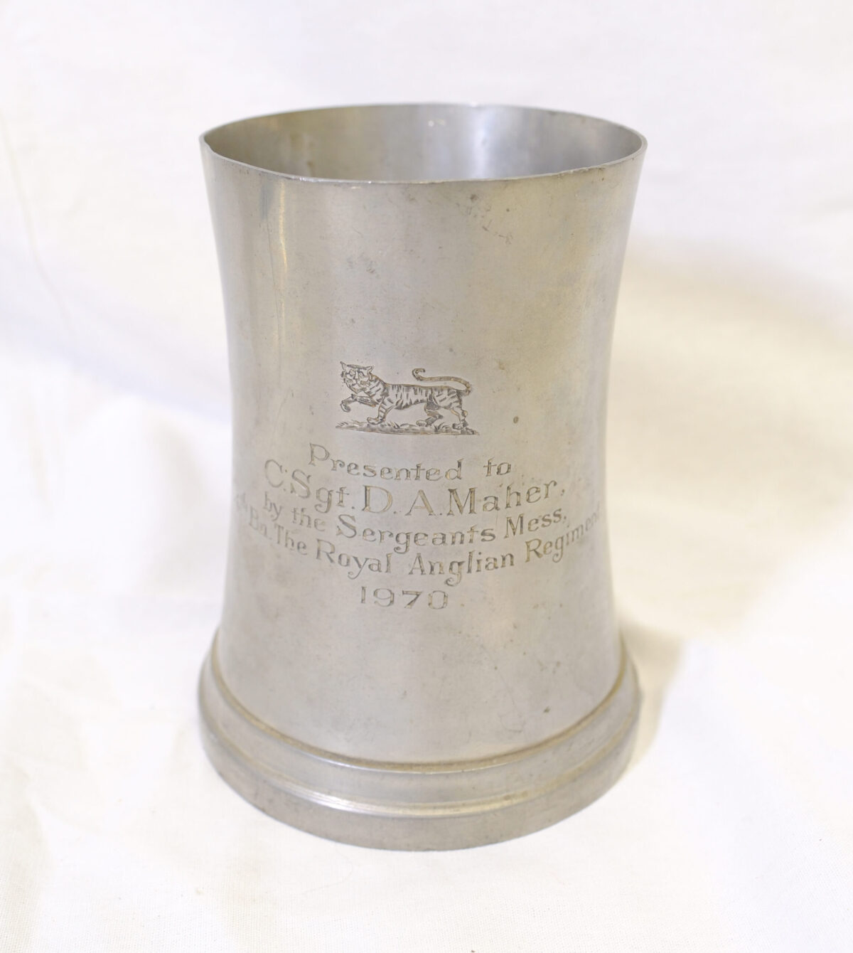 Pewter presentation mug. Presented to Colour Sergeant D A Maher in 1970 by the Sergeants' Mess. 4th Battalion Royal Anglian Regiment Pewter presentation mug. Presented to Colour Sergeant D A Maher in 1970 by the Sergeants' Mess. 4th Battalion Royal Anglian Regiment