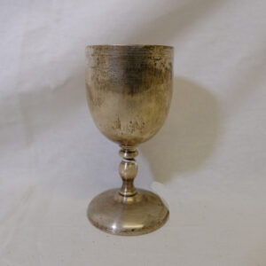 Silver coloured metal goblet with inscription near rim WO2 boss Royal Anglian Regiment beneath it is emblem of a crown with the initials QD of The Queen's Division