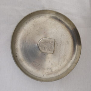 Small silver ashtray given to a member of the ceasefire group who monitored the change over to Zimbabwe