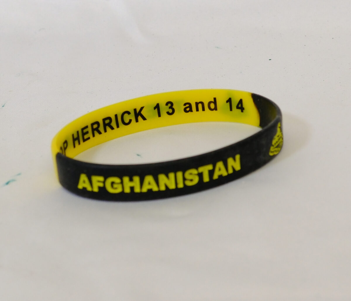 Afghanistan Operation Herrick 13 and 14 Wrist Band as worn by soldiers from the Royal Anglian Regiment. Afghanistan Operation Herrick 13 and 14 Wrist Band as worn by soldiers from the Royal Anglian Regiment.