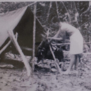 Royal Anglian Regiment in Malaya in 1960. Don Ellis building a basha
