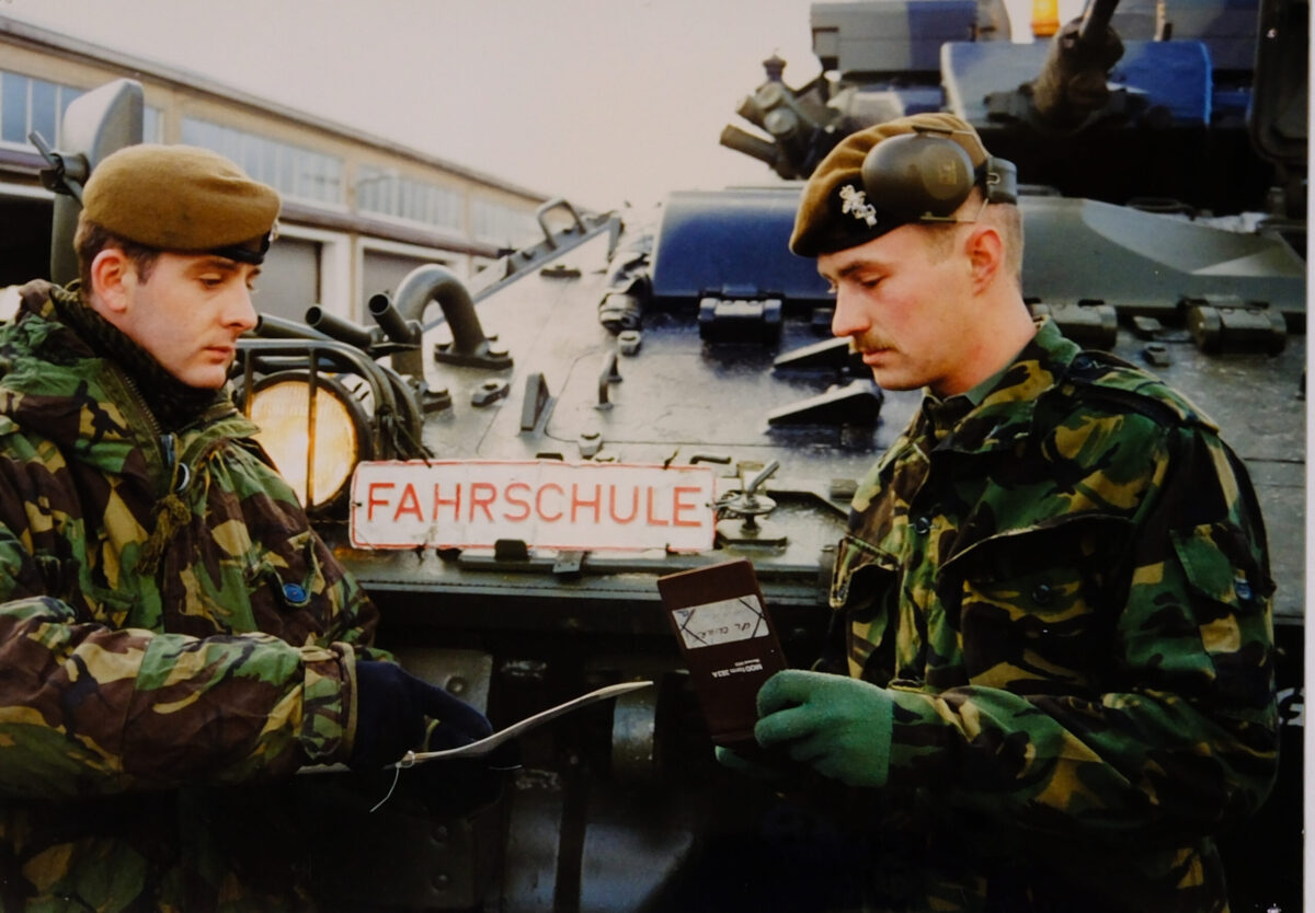Royal Anglian Regiment soldier discussing plans with Soldier from the Yorkshire Regiment in Germany Royal Anglian Regiment soldier discussing plans with Soldier from the Yorkshire Regiment in Germany