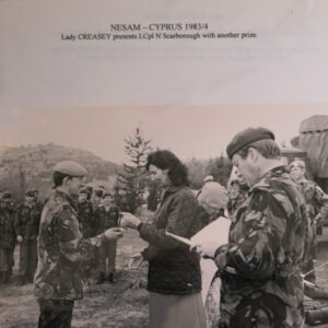 NESAM Cyprus 1983/84. Lady Creasey presents Lance Corporal N Scarborough a prize. NESAM Cyprus 1983/84. Lady Creasey presents Lance Corporal N Scarborough a prize.