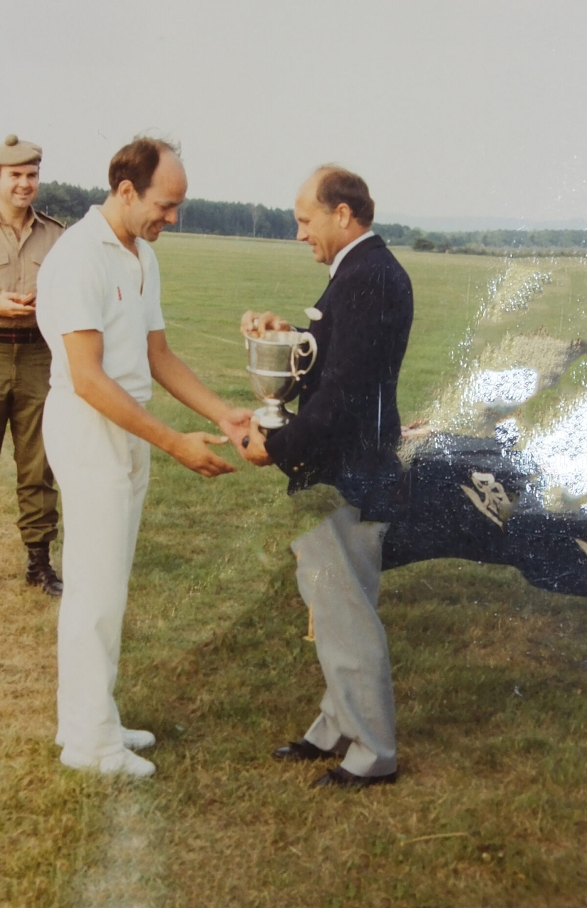 Brigadier Colin Groves presents a prize for a cricket match Brigadier Colin Groves presents a prize for a cricket match