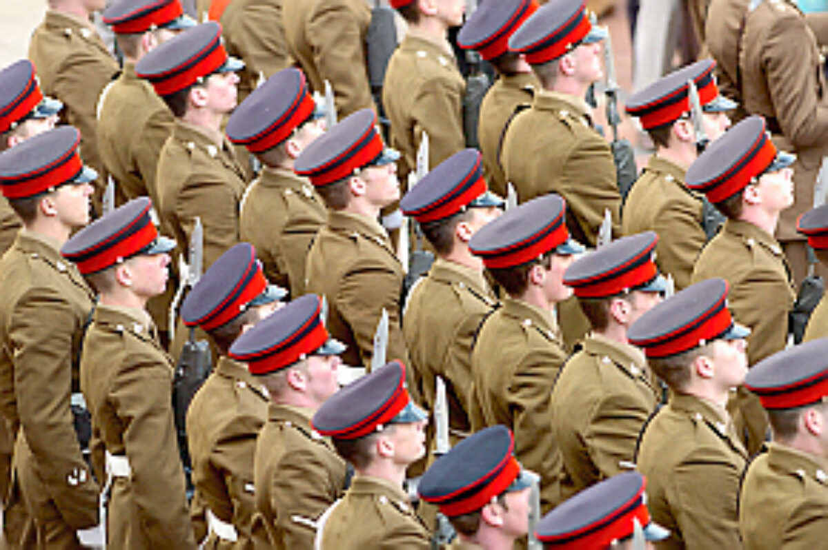 Royal Anglian March : Soldiers from the 2nd Battalion Royal Anglian Regiment march through Leicester city centre. The scene in Town Hall Square. Pictured are the troops being inspected by Lord Mayor Paul Westley with Lieutenant General John McColl.