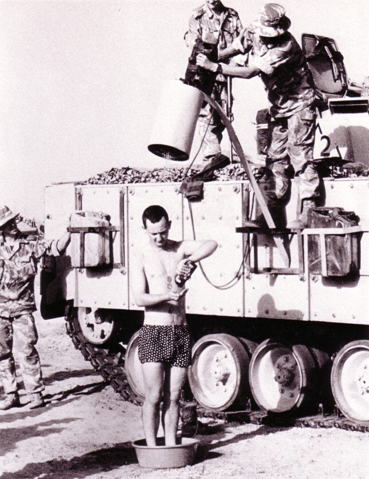 Shower arrangements in Kuwait, 1991 Sometimes a soldier has to adapt and ‘make do’ if there are no proper facilities.