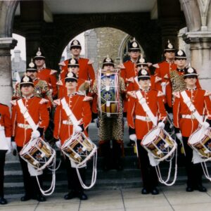 Corps of Drums, 5th Battalion, Remembrance Day, Peterborough, 1991 The Corps of Drums are wearing Full Dress ceremonial uniform. The Drum Major (bottom row, far right) is holding his ceremonial mace. The soldier on the bottom row, far left is the Pioneer Sergeant who wears an apron and carries an axe on ceremonial occasions.