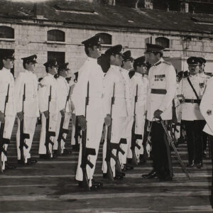 Brig Ngel H Birbeck. the Deputy Fortress Commander in Gibraltar, salutes the Regimental Colour