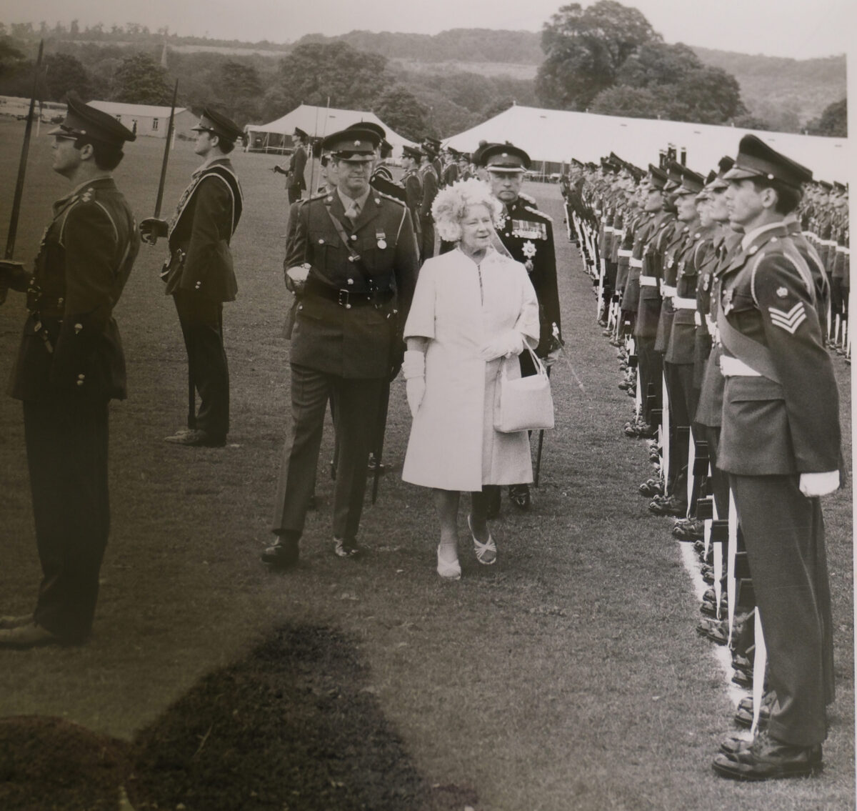 Royal Anglian Regiment. HRH The Queen Mother, with the Colour party,  12 July 1974 at Tidworth Garrison.