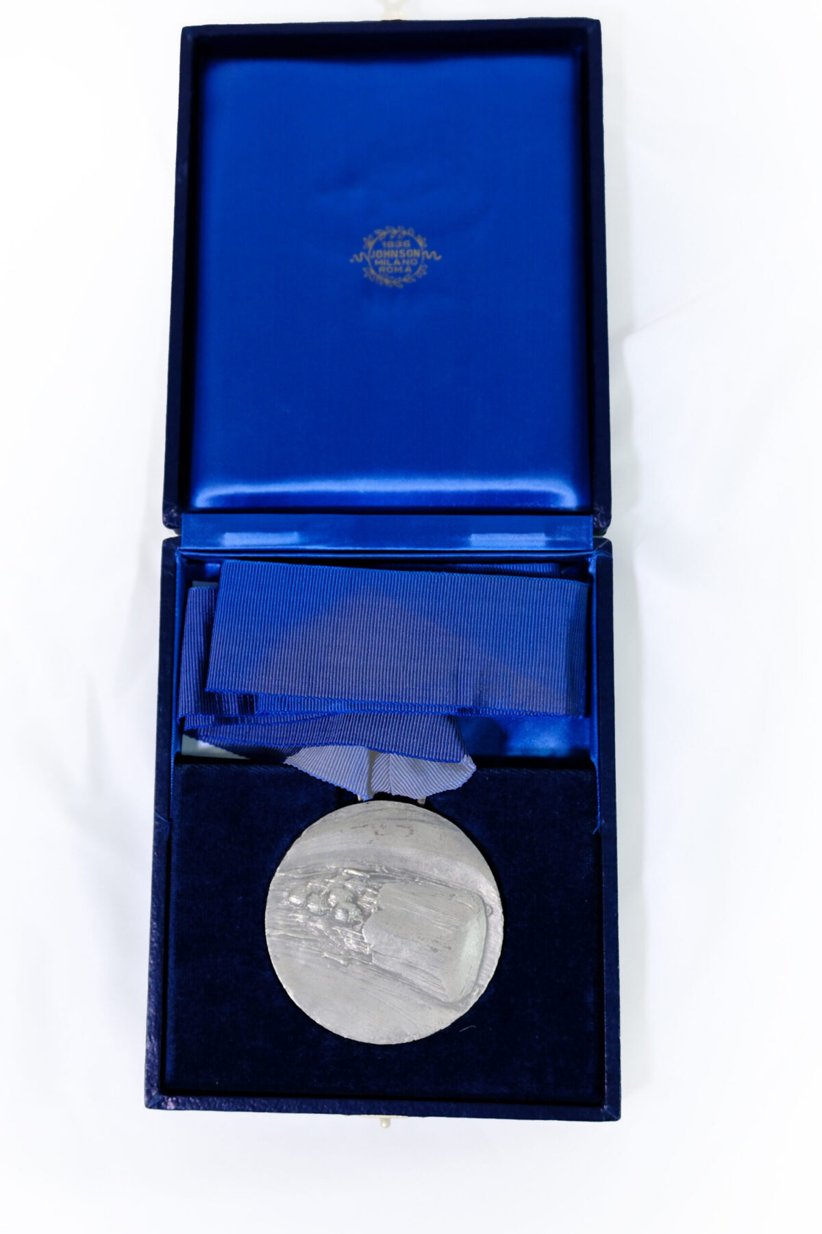commemorative medallion produced by the historic Italian manufacturer Stefano Johnson (Milano-Roma), rather than an Olympic winners' medal or a piece associated with the Royal Anglian Regiment