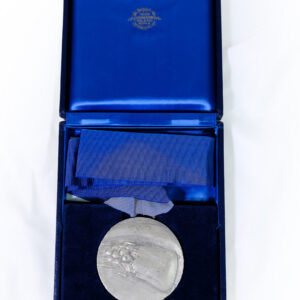 commemorative medallion produced by the historic Italian manufacturer Stefano Johnson (Milano-Roma), rather than an Olympic winners' medal or a piece associated with the Royal Anglian Regiment commemorative medallion produced by the historic Italian manufacturer Stefano Johnson (Milano-Roma), rather than an Olympic winners' medal or a piece associated with the Royal Anglian Regiment