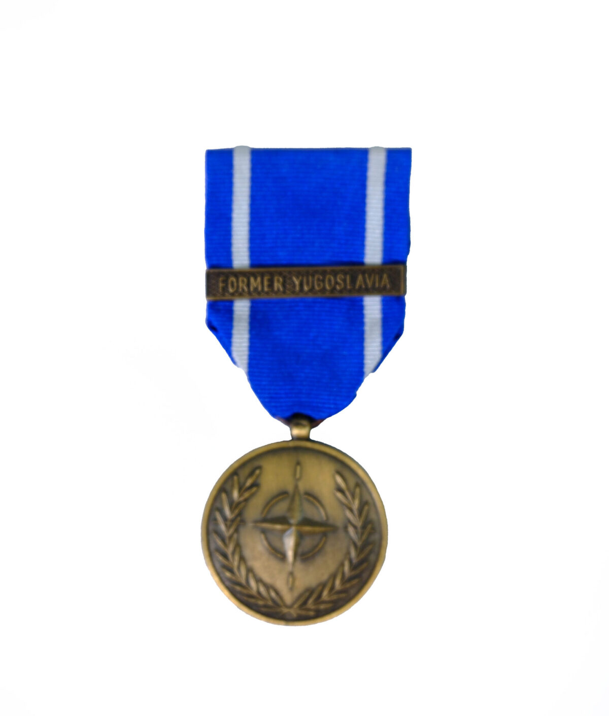 miniature version of the NATO Medal for the Former Yugoslavia, featuring a bronze-finish circular medallion with the NATO star emblem surrounded by a wreath, suspended from a blue ribbon with white edge stripes and a 